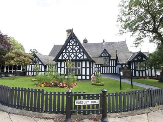 View of The Court House, Worsley from Worsley road entrance with a view of the small grassed area.